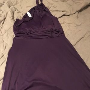 One shoulder purple dress.